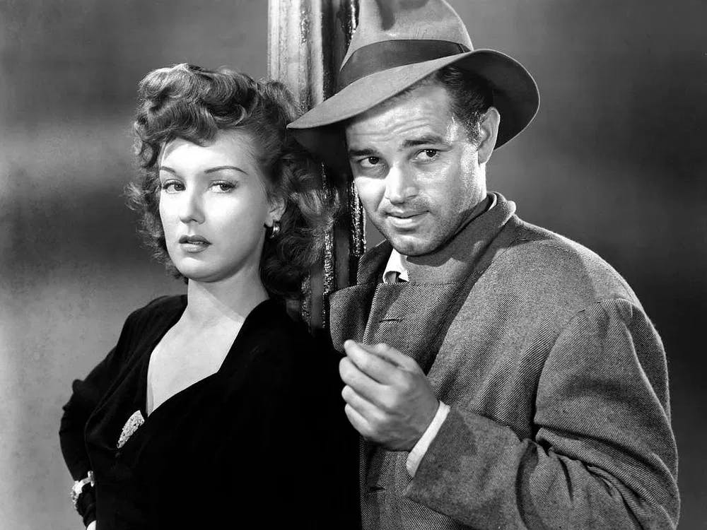 Down and Dirty in the California desert: Ann Savage and Tom Neal in "Detour" / Publicity still in the public domain.